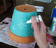 step-2- apply-decoration-with-dimensional-paint-to-pot.jpg